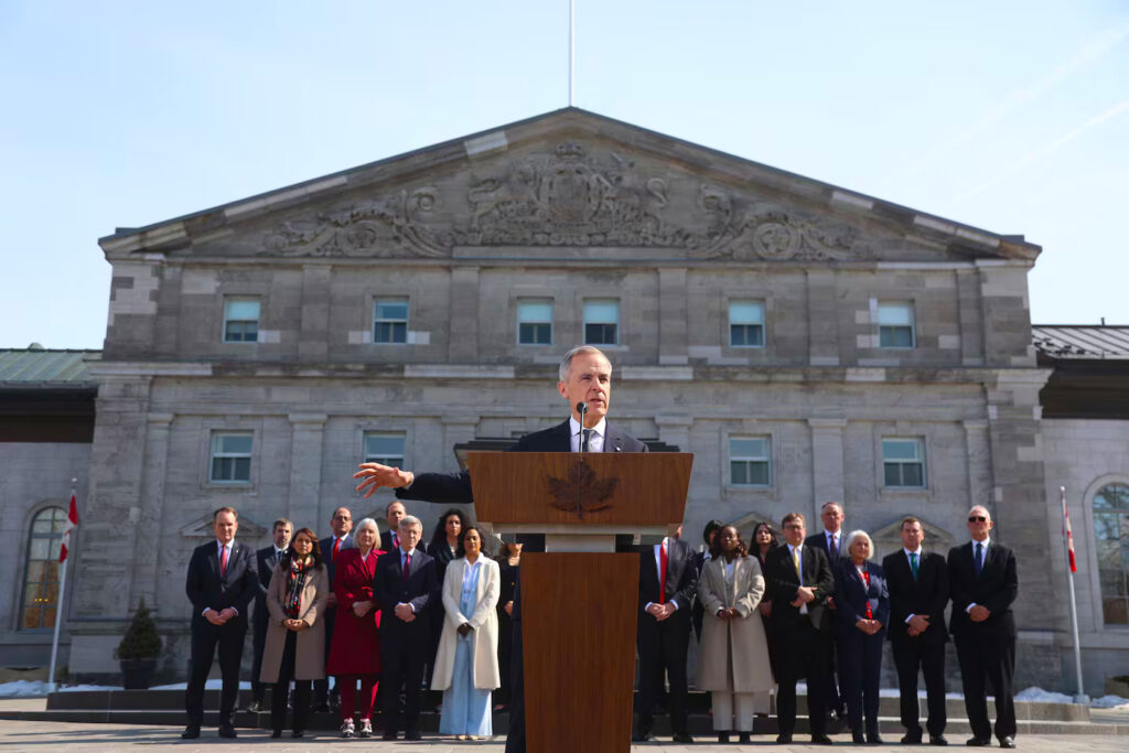 Canada's Prime Minister Mark Carney spoke during a news conference with his Cabinet ministers at Rideau Hall after a swearing-in ceremony on March 14, in Ottawa. DAVE CHAN/AFP via Getty Images