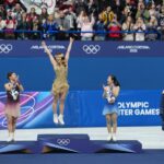 Gold medalist Alysa Liu of the United States, silver medalist Kaori Sakamoto of Japan, and bronze medalist Ami Nakai of Japan, celebrate on the podium during the medal ceremony on Thursday. James Lang/Imagn Images/Reuters