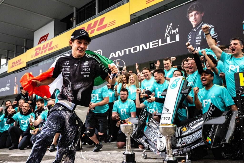 Mercedes' Italian driver Kimi Antonelli celebrates with his team after winning the Formula One Japanese Grand Prix at the Suzuka circuit in Suzuka, Mie prefecture on March 29, 2026. (Photo by Philip FONG / AFP)